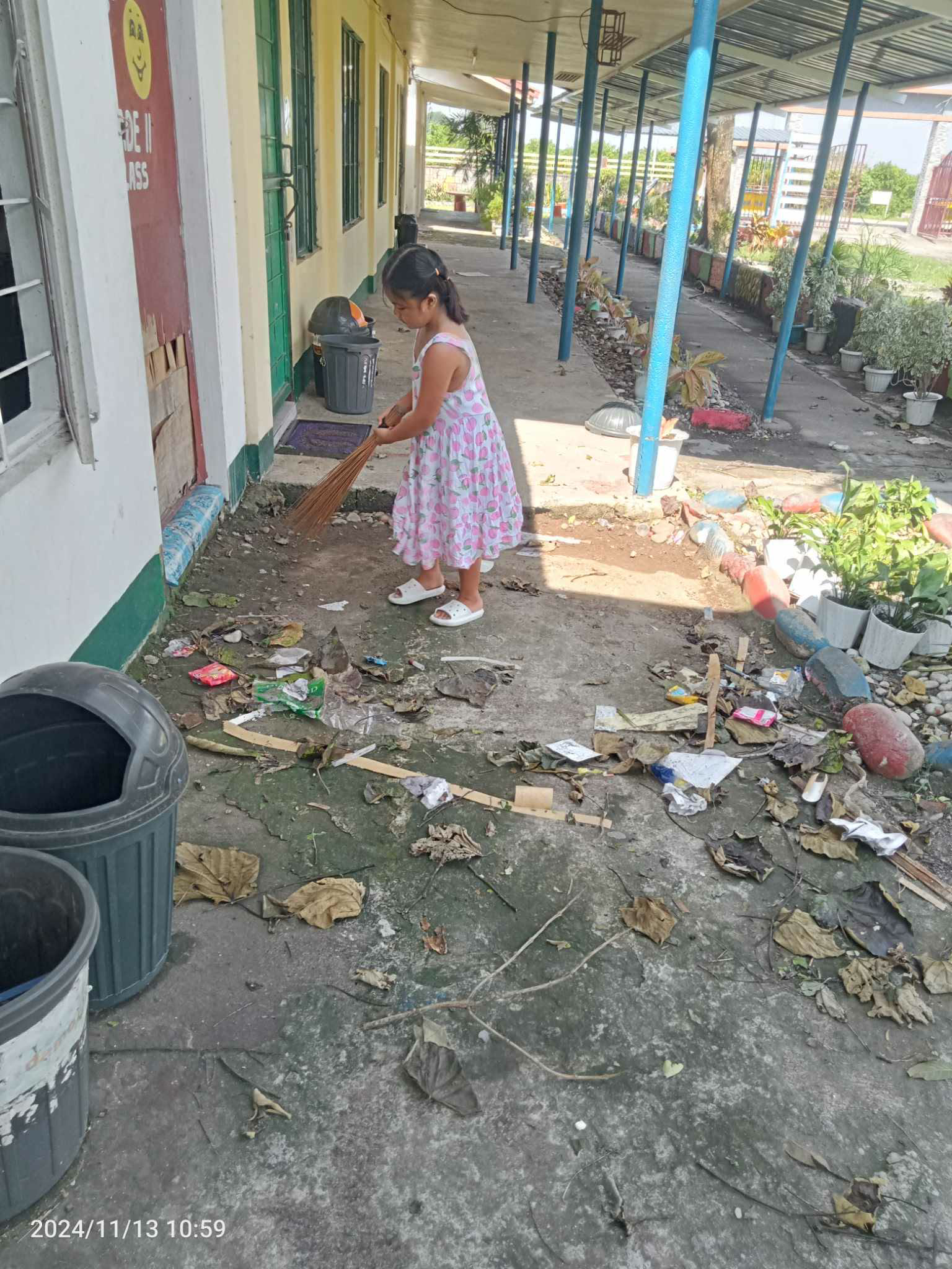 Student cleaning at Macatal Elementary School