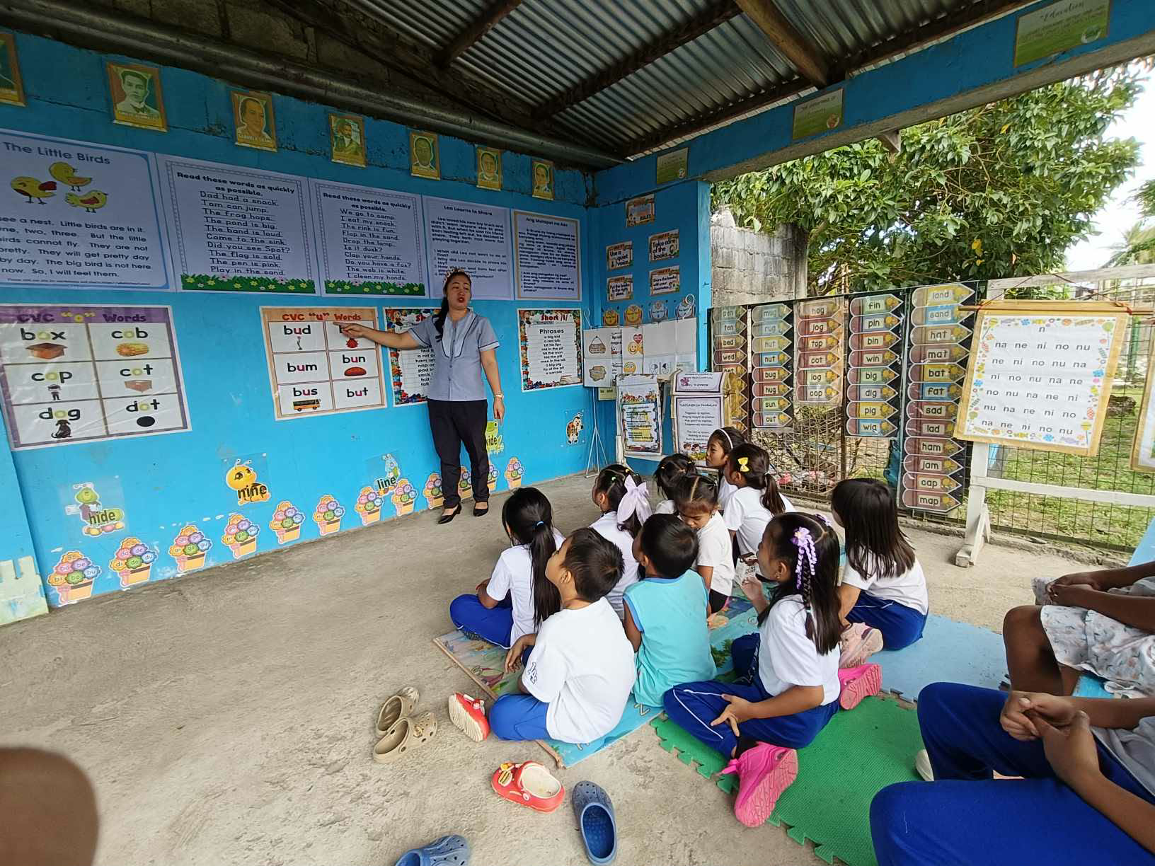 Teacher working with students in class